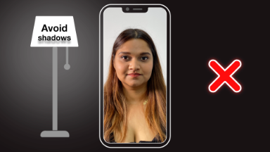 A photo of a student with light coming form the left of their face. The photo is insode a cartoon mock up of a phone and a cartoon light to the left, with a red X on the right.