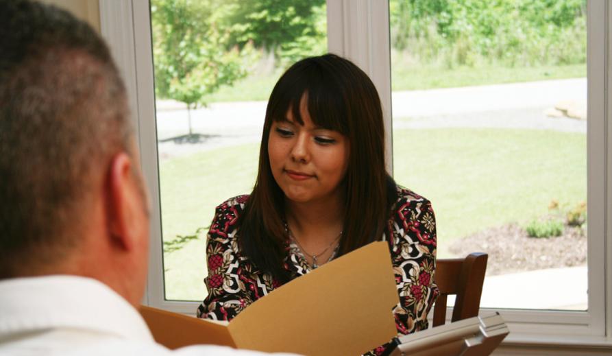 Image of two people speaking. Image of two people speaking.